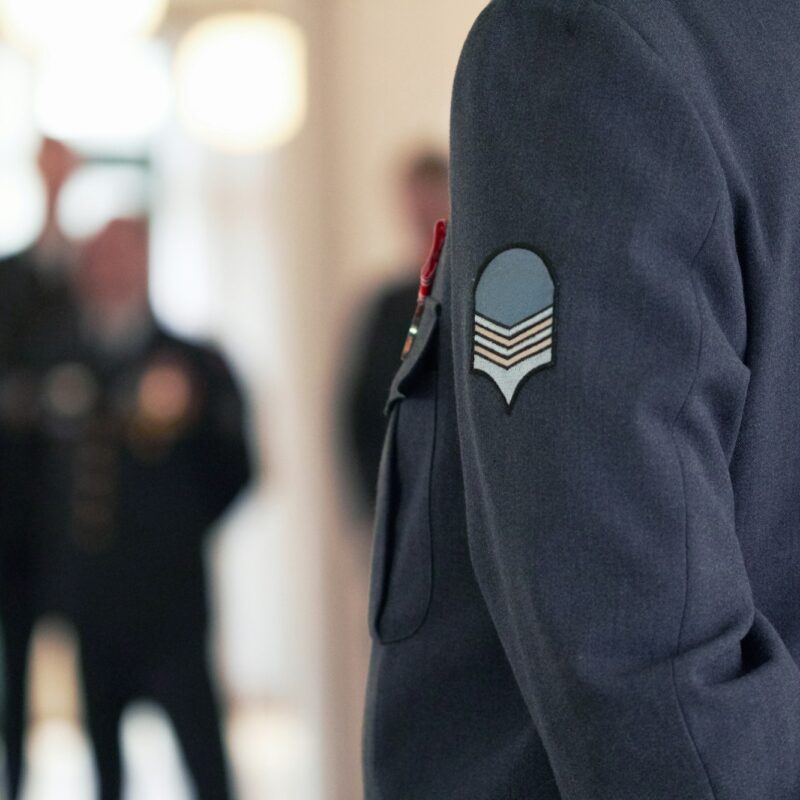 Willing and able to defend. Shot of a military badge on a high ranking officers jacket.